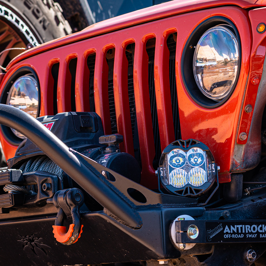 Baja Designs LP4 Pro LED driving light showing combo beam optic lens detail