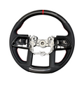 Aspire Auto Accessories carbon fiber steering wheel with red stripe accent and contrast stitching